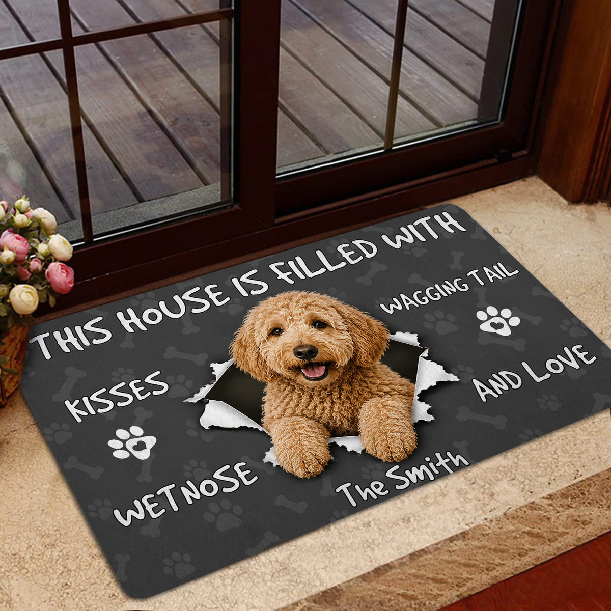 Goldendoodle doormat styled inside a glass doorway with a friendly dog artwork and dark background