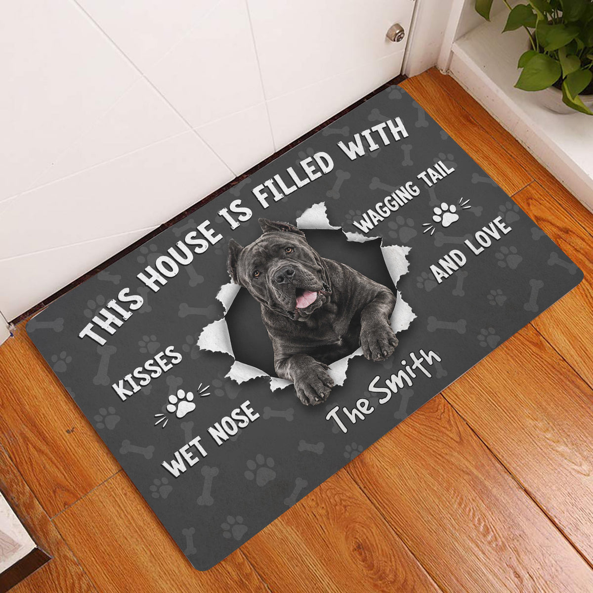 Cane Corso doormat displayed at a home entrance on a warm wood floor