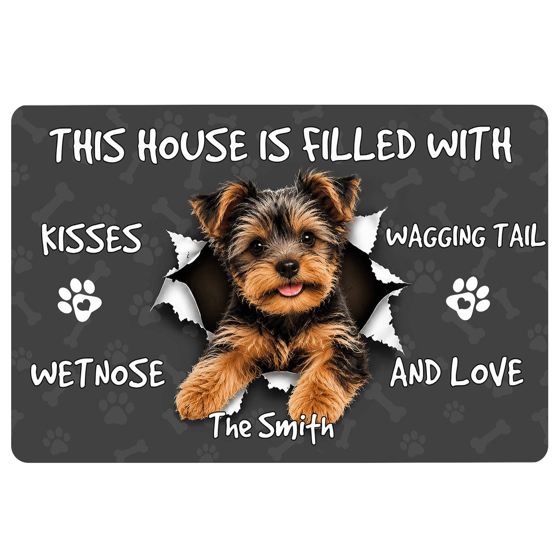Yorkie doormat with a cheerful Yorkshire Terrier bursting through a dark paw and bone pattern