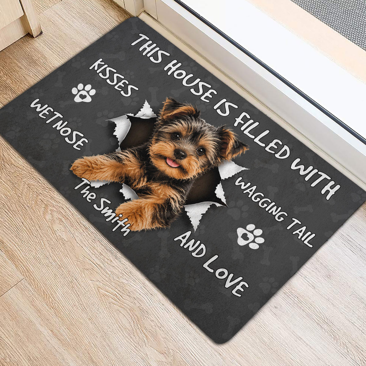 Yorkshire Terrier welcome mat displayed at a doorway with a playful dog and paw print artwork