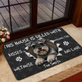 Miniature Schnauzer door mat shown in a home entrance beside a glass door and indoor flooring