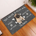 Pug doormat displayed by a white door on a wood floor in an entryway