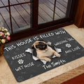 Pug door mat styled in a home entrance beside glass doors and an indoor rug