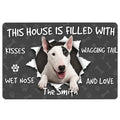 Bull Terrier doormat with a cheerful white dog portrait, paw prints, bones, and playful entryway message