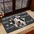 Bull Terrier doormat styled inside near a glass door with a playful dog portrait