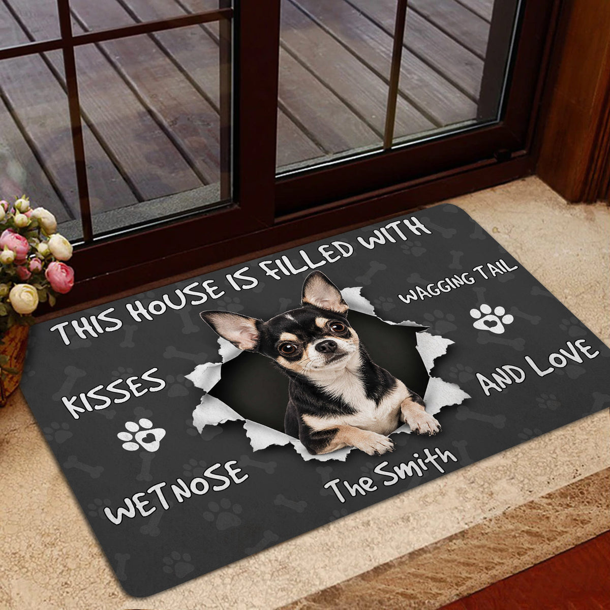Chihuahua doormat shown by a glass door with a playful dog portrait and paw print accents