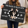 Person holding a Chihuahua doormat featuring a dog portrait, paw prints, bones, and welcoming lettering