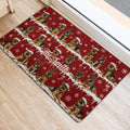 Holiday German Shepherd door mat placed near an entryway with Santa hats, snowflakes, ornaments, and stockings