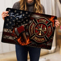 Firefighter doormat held indoors showing a large fire department emblem, axe, flames, and patriotic stars