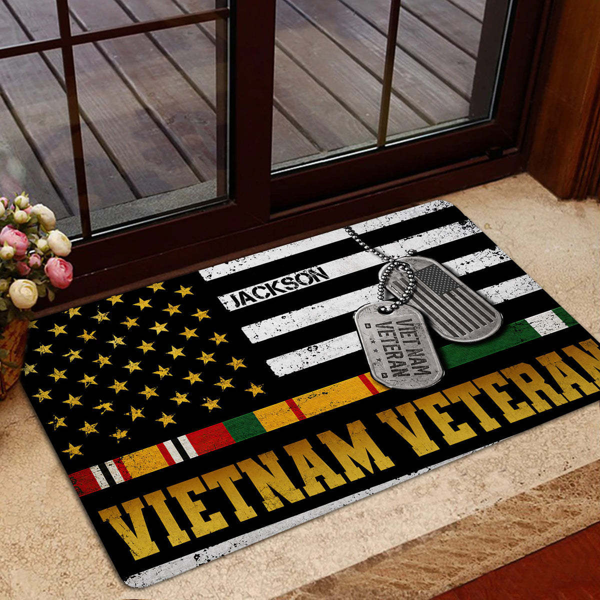 Vietnam Veteran door mat shown inside a glass doorway with patriotic flag artwork and military tribute details