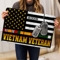 Vietnam Veteran doormat held indoors, displaying distressed stars, service ribbons, dog tags, and bold tribute lettering