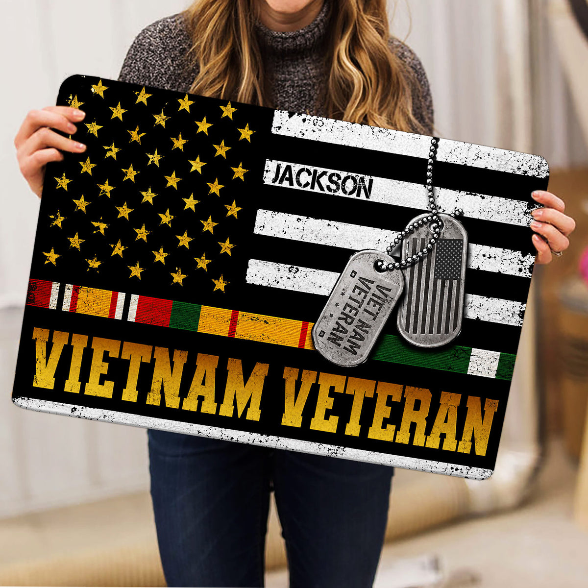 Vietnam Veteran doormat held indoors, displaying distressed stars, service ribbons, dog tags, and bold tribute lettering