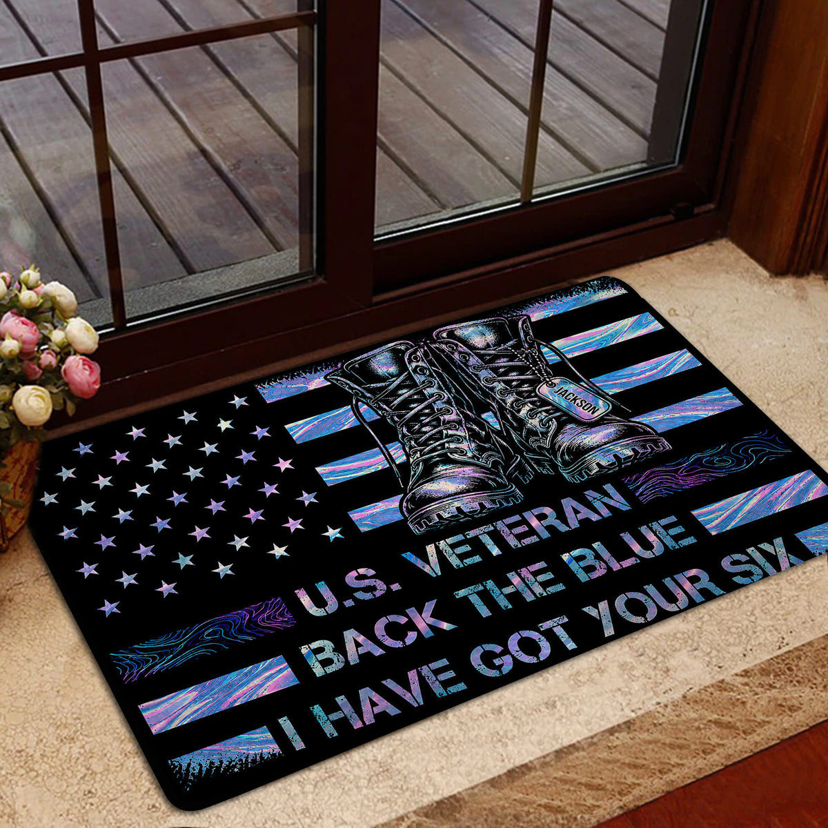 Veteran doormat styled near a glass door with military boots, stars, and colorful patriotic artwork