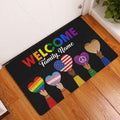 LGBT welcome doormat displayed in an entryway with colorful pride hearts and inclusive artwork