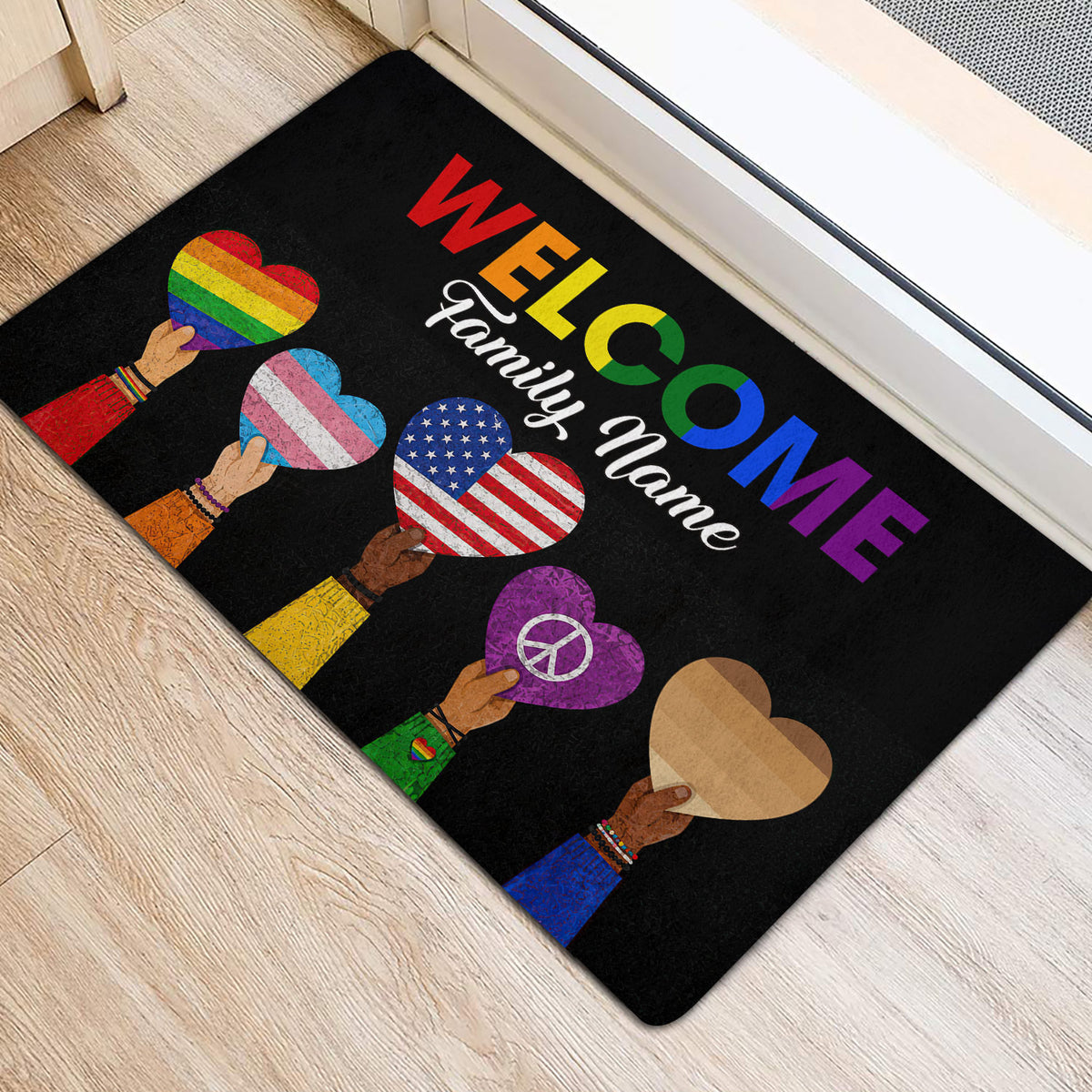 Rainbow LGBT welcome rug placed beside a doorway with colorful heart and peace symbols