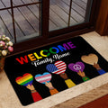 LGBT pride welcome mat displayed at a home entrance with colorful hearts and inclusive artwork
