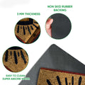 Close-up of the evil eye doormat showing the printed top surface and black rubber backing