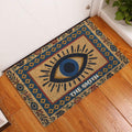 Evil eye entryway rug displayed by a white door on warm wood flooring