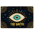 Evil eye doormat with a turquoise eye, gold sun rays, stars, and ornate dark blue mandala borders