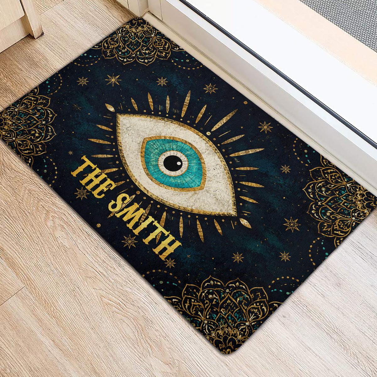 Evil eye door mat placed at an interior entrance with gold and turquoise decorative details