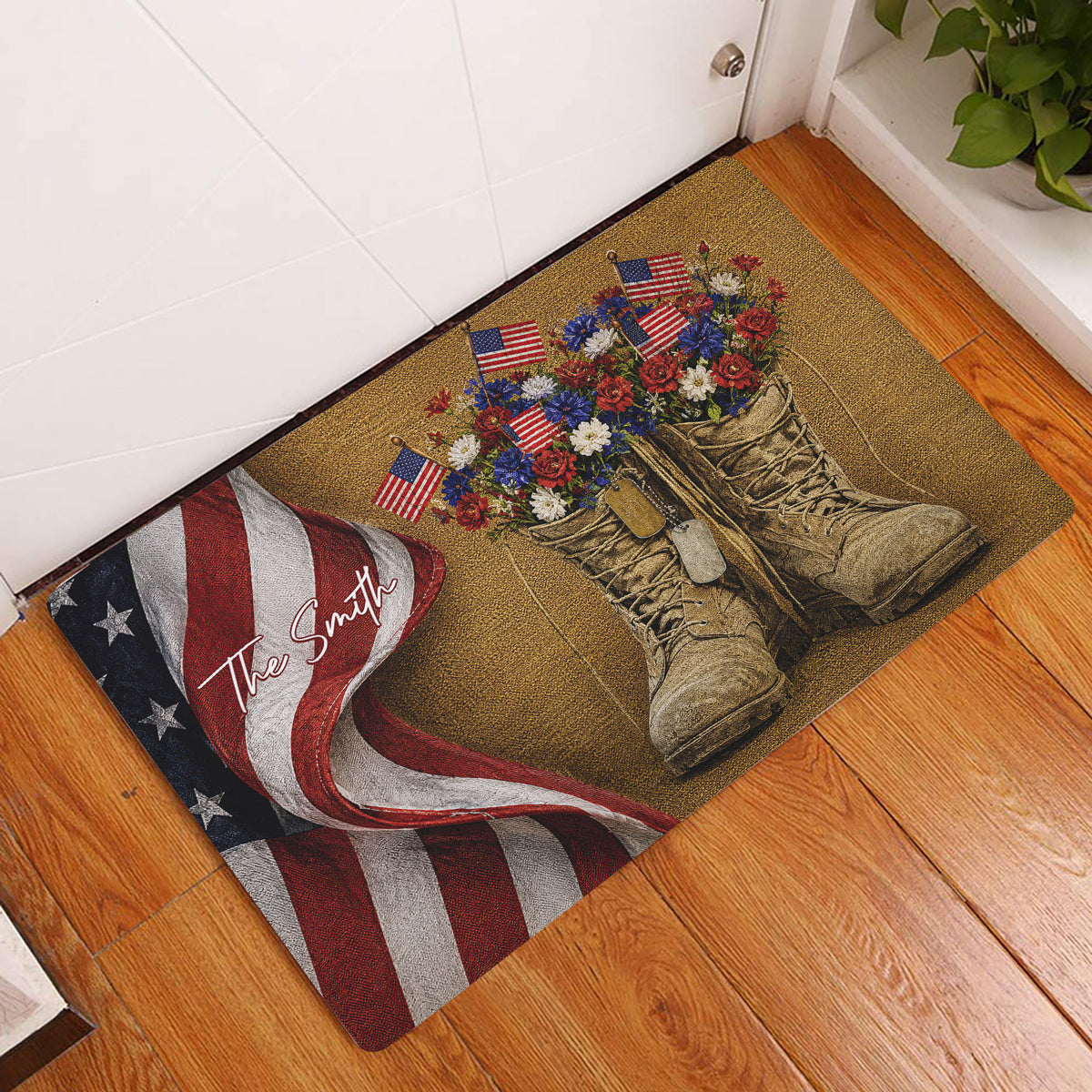 Patriotic veteran rug displayed at a home entrance with combat boots, flags, flowers, and a folded American flag