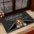 Beagle welcome mat staged at a glass entry door with a playful doghouse illustration