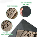 Close-up of Viking rune doormat artwork showing the printed surface and black rubber backing