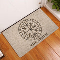 Viking rune doormat displayed at an indoor doorway on warm wood flooring