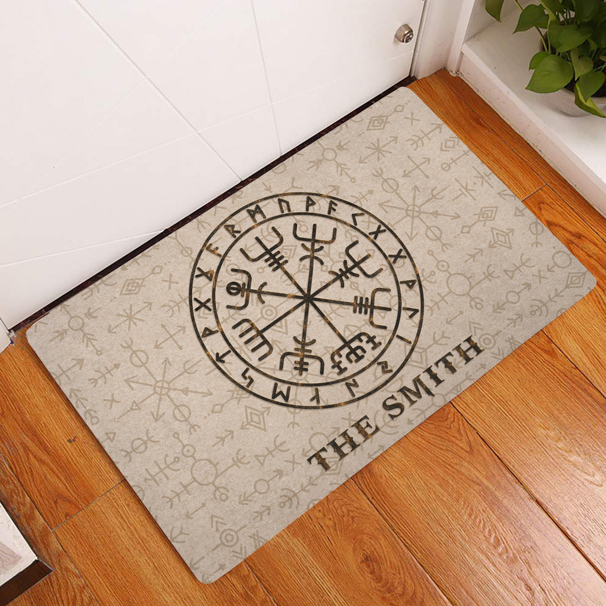 Viking rune doormat displayed at an indoor doorway on warm wood flooring