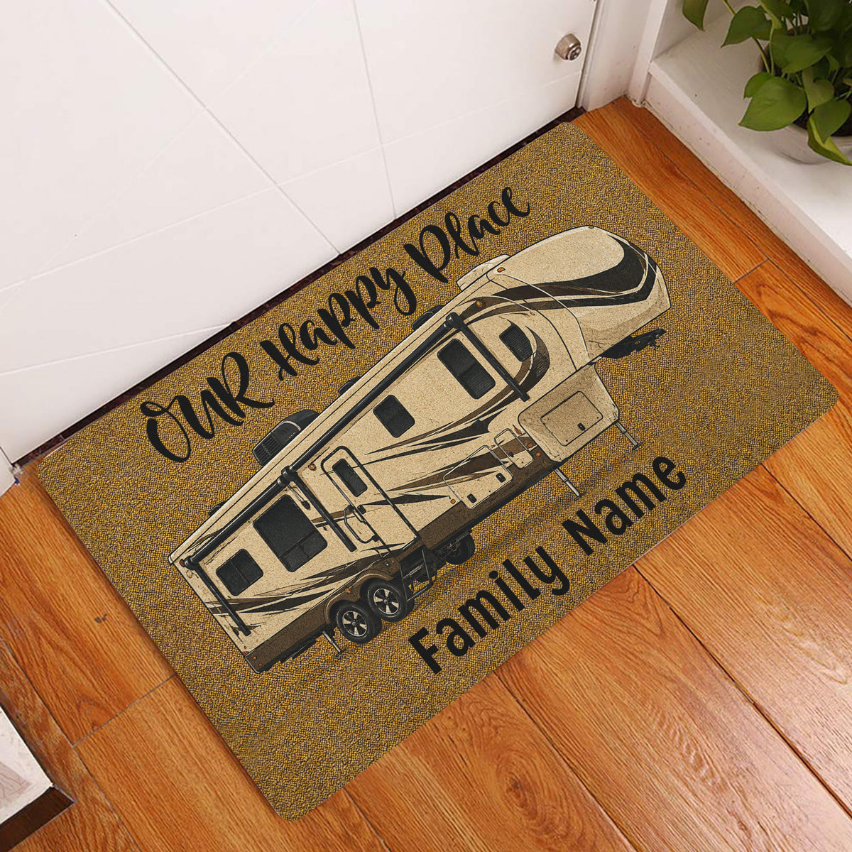 Travel trailer camping doormat displayed at a home entrance on a wood floor