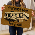 Lifestyle view of a travel trailer camping doormat held indoors