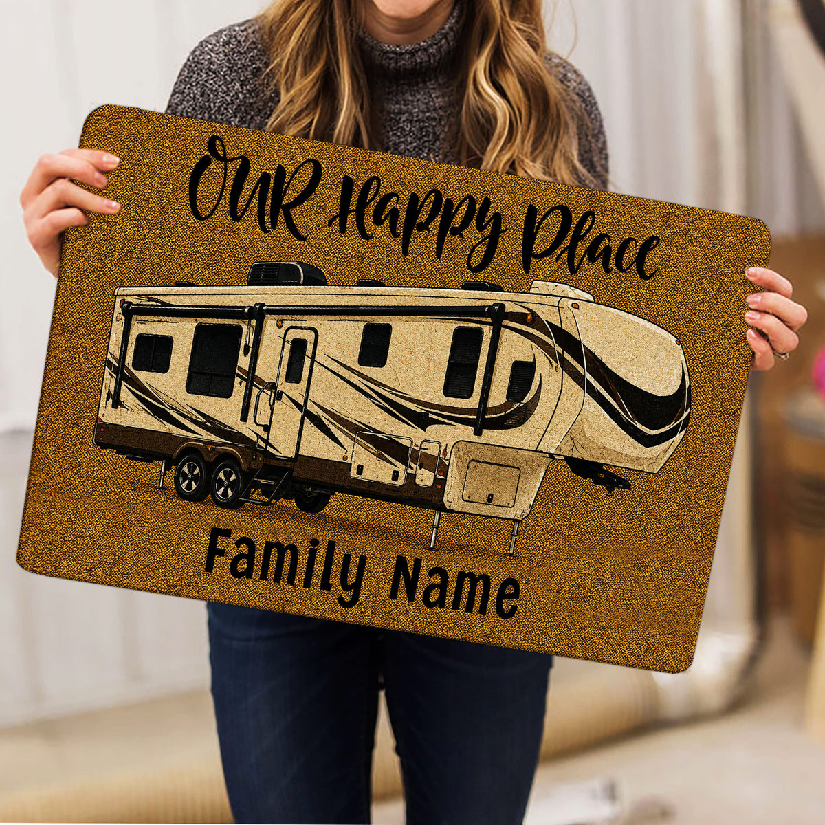 Lifestyle view of a travel trailer camping doormat held indoors