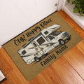 RV camping doormat displayed by a home entrance on wood flooring with a warm ochre and black design
