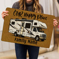 Camping RV doormat held indoors, showing a detailed camper illustration and welcoming family entryway artwork