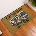 Camping RV doormat styled on a wood floor near a white door in a home entryway