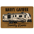 Camping doormat featuring a travel trailer, Happy Camper lettering, and a family-themed script message