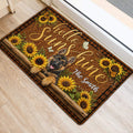 German Shepherd welcome mat displayed beside a doorway with sunflowers, butterflies and rustic decor