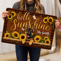 Person holding a German Shepherd doormat featuring sunflowers, butterflies and a rustic welcome design