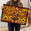 Person holding a Yorkie doormat featuring a smiling Yorkshire Terrier, sunflowers, butterflies, and welcoming script