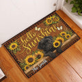 Pug and sunflower doormat displayed in a bright indoor entryway beside a white door
