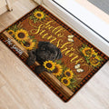 Decorative pug entryway rug with sunflowers, butterflies, wood plank artwork, and plaid border
