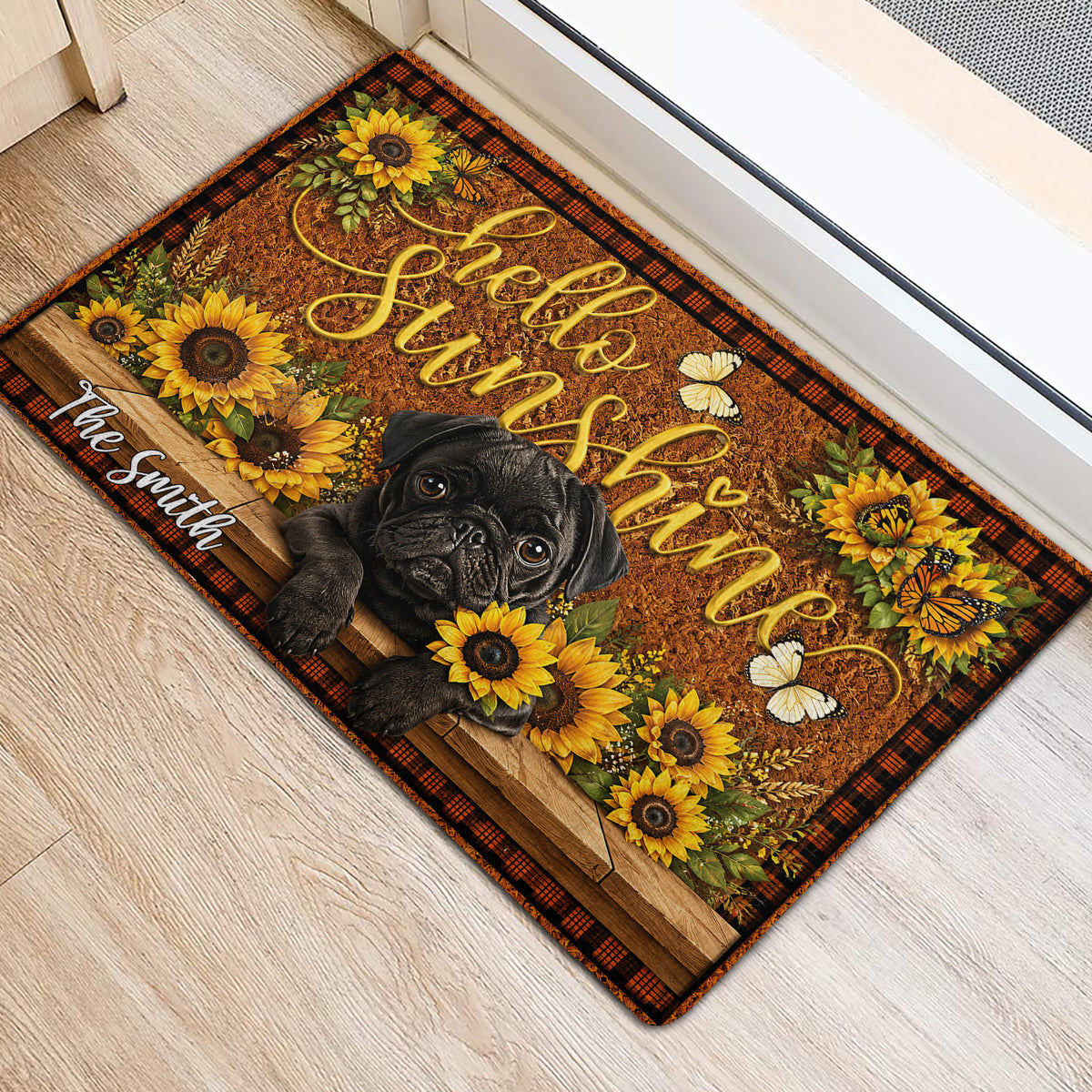 Decorative pug entryway rug with sunflowers, butterflies, wood plank artwork, and plaid border