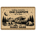 Camping doormat with RV, tent, campfire, mountains, lake and evergreen trees in a rustic tan design