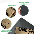 Close-up view of the camping doormat surface and black rubber backing with printed RV artwork