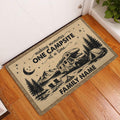 Rustic camping doormat displayed in a home entryway beside a white door and wood floor