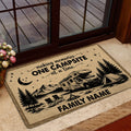 Camping doormat staged by a glass door with an RV, tent, campfire and mountain campsite artwork