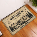 Rustic camping doormat displayed in a home entryway with RV, mountain, forest, and campfire artwork