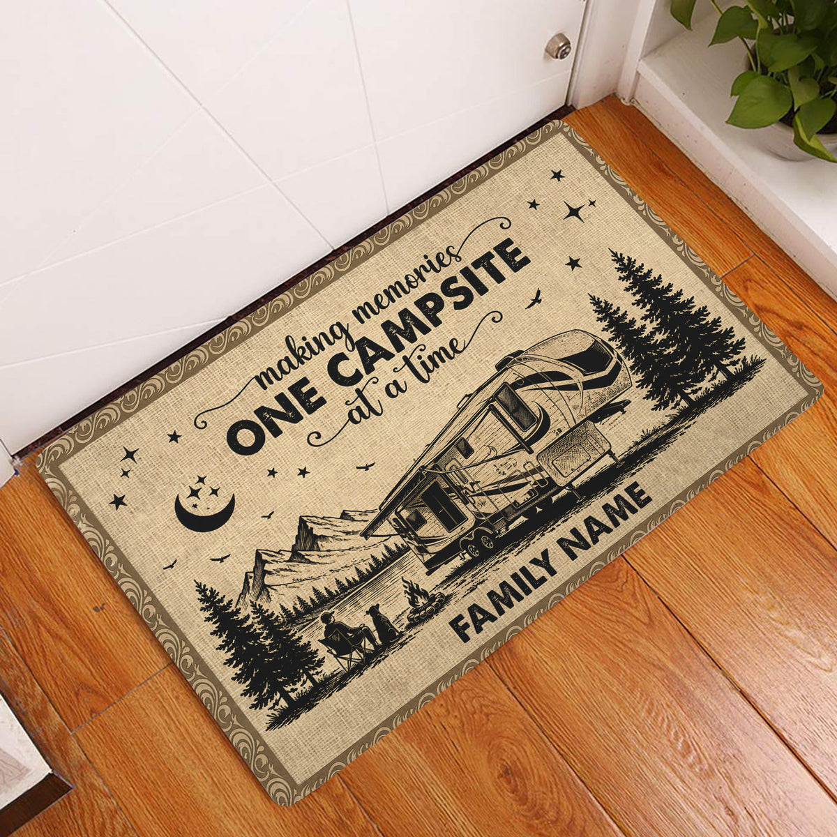 Rustic camping doormat displayed in a home entryway with RV, mountain, forest, and campfire artwork
