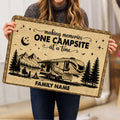 Camping-themed doormat held indoors, showing an RV beside mountains, pine trees, stars, and a campfire