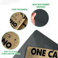 Close-up view of the camping doormat surface and dark rubber backing with construction feature callouts